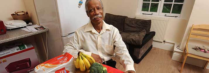 TB patient with food bought from the Patient Support Fund